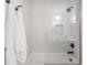 Modern bathtub with white subway tile and glass screen at 11896 Spring Mill Rd, Carmel, IN 46032
