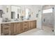 Spacious bathroom featuring double vanity, quartz countertop, and glass-enclosed shower at 11896 Spring Mill Rd, Carmel, IN 46032