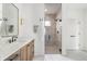 Bathroom features a light-filled shower with modern fixtures and neutral tiling at 11896 Spring Mill Rd, Carmel, IN 46032