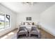 Bedroom with natural lighting, and featuring seating area and neutral decor at 11896 Spring Mill Rd, Carmel, IN 46032