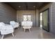 Relaxing outdoor patio with cozy furniture and a ceiling fan for added comfort at 11896 Spring Mill Rd, Carmel, IN 46032