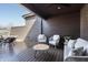 Enjoy this covered patio with an outdoor seating area, perfect for relaxing at 11896 Spring Mill Rd, Carmel, IN 46032