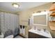 Functional bathroom with tiled shower, vanity storage, and clean modern design at 232 N Church St, Morgantown, IN 46160