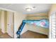 Cozy bedroom featuring a unique lofted bed and ample natural light at 232 N Church St, Morgantown, IN 46160
