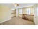 Upstairs bedroom with closet and natural light, featuring wooden railing at 232 N Church St, Morgantown, IN 46160