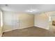 Bonus room with plenty of natural light and neutral carpet flooring at 232 N Church St, Morgantown, IN 46160