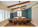 Bright dining area featuring blue accents, wood floors, a ceiling fan, and built-in bench seating at 232 N Church St, Morgantown, IN 46160