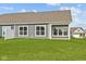 Backyard featuring a gray exterior and a well-manicured lawn at 3537 Wrangler Dr, Bargersville, IN 46106