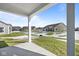 View of the backyard and surrounding neighborhood from the covered patio at 3537 Wrangler Dr, Bargersville, IN 46106