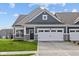 Charming home featuring a gray facade, a two-car garage, and a well-manicured front lawn at 3537 Wrangler Dr, Bargersville, IN 46106