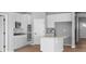 Bright kitchen features white cabinets, stainless appliances, and a center island at 3537 Wrangler Dr, Bargersville, IN 46106