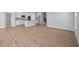 Spacious open-concept living room with views of kitchen and staircase at 3537 Wrangler Dr, Bargersville, IN 46106