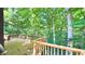 Inviting back deck surrounded by lush trees, offering a peaceful outdoor retreat at 808 Copperfield Xing, Danville, IN 46122