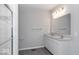 Modern bathroom with a double vanity, glass-enclosed shower, and sleek fixtures at 8165 Cindy Cir, Martinsville, IN 46151