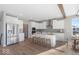 Modern kitchen featuring stainless steel appliances, an island with seating, and wood floors at 8165 Cindy Cir, Martinsville, IN 46151