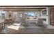 Sun-filled living room and dining area featuring hardwood floors and a cozy fireplace at 8165 Cindy Cir, Martinsville, IN 46151