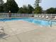 A community swimming pool area featuring lounge chairs and fencing for privacy in an outdoor setting at 8168 Shorewalk Dr # A, Indianapolis, IN 46236