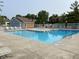 Community pool featuring lounge chairs and a bright blue swimming area for relaxing and enjoying the outdoors at 8168 Shorewalk Dr # A, Indianapolis, IN 46236