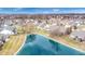 Aerial view shows community pond with walking path surrounded by well-maintained residential properties at 1463 Hamilton Dr, Greenwood, IN 46143