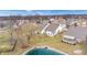 An aerial view of homes with ponds and well-maintained yards at 1463 Hamilton Dr, Greenwood, IN 46143