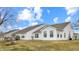 Backyard featuring a deck, lawn, and beautiful sky at 1463 Hamilton Dr, Greenwood, IN 46143