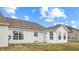 The backyard has a concrete patio and a grassy yard at 1463 Hamilton Dr, Greenwood, IN 46143