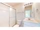 Bright bathroom featuring modern fixtures, a vanity, toilet, and shower with sliding glass door at 1463 Hamilton Dr, Greenwood, IN 46143