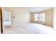 Bedroom with carpet, large window and doorway leading to the living room at 1463 Hamilton Dr, Greenwood, IN 46143
