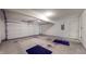 Spacious two-car garage with a clean concrete floor and an automatic garage door at 1463 Hamilton Dr, Greenwood, IN 46143