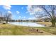 A backyard view of pond with a beautiful landscape at 1463 Hamilton Dr, Greenwood, IN 46143
