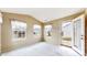 Cozy sun room with multiple windows and access to the outdoors at 1463 Hamilton Dr, Greenwood, IN 46143