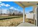 Back porch view of the backyard with trees, level lot, and a privacy fence at 18425 Depoe Ln, Westfield, IN 46074