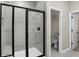 Modern bathroom with a tiled shower and glass door at 18425 Depoe Ln, Westfield, IN 46074