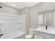 Well-lit bathroom featuring a bathtub and a sink at 18425 Depoe Ln, Westfield, IN 46074
