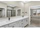 Bathroom with a double sink vanity, modern fixtures, and tile flooring at 18425 Depoe Ln, Westfield, IN 46074