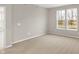 Bedroom features neutral carpet, paint and bright window at 18425 Depoe Ln, Westfield, IN 46074