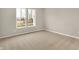 Bedroom features neutral carpet, paint and bright window at 18425 Depoe Ln, Westfield, IN 46074
