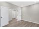 A well-lit bedroom with vinyl floors and a neutral color scheme featuring a doorway and closet at 18425 Depoe Ln, Westfield, IN 46074