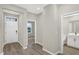 Welcoming entryway with a white front door, wood-style floors, and access to a half bathroom at 18425 Depoe Ln, Westfield, IN 46074