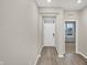 Bright entryway with modern gray walls, wood-look flooring, and a view into the living area at 18425 Depoe Ln, Westfield, IN 46074