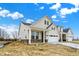 Attractive exterior showing the home's facade, a long driveway, and landscaping potential at 18425 Depoe Ln, Westfield, IN 46074