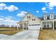 Charming home exterior featuring a well-maintained lawn, a wide driveway, and lovely architectural details at 18425 Depoe Ln, Westfield, IN 46074