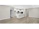 Bright, open kitchen featuring a large island, stainless appliances, and white cabinetry at 18425 Depoe Ln, Westfield, IN 46074