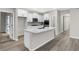 Modern kitchen with large island, stainless appliances, and white cabinetry at 18425 Depoe Ln, Westfield, IN 46074