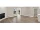 Living room featuring vinyl floors, a fireplace, and sliding door to backyard at 18425 Depoe Ln, Westfield, IN 46074