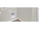 Close-up of a wall corner with baseboard and utilities hookups at 18425 Depoe Ln, Westfield, IN 46074