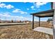 This backyard features a covered patio and views of the surrounding landscape at 20378 Hudson Bay Ln, Westfield, IN 46074