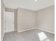 This bedroom features neutral walls, plush carpet, and a door to other rooms at 20378 Hudson Bay Ln, Westfield, IN 46074