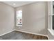 Bedroom space with wood-look floors, neutral paint and a window providing natural light at 20378 Hudson Bay Ln, Westfield, IN 46074