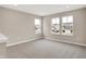Bonus room with neutral carpeting and large windows overlooking neighborhood at 20378 Hudson Bay Ln, Westfield, IN 46074
